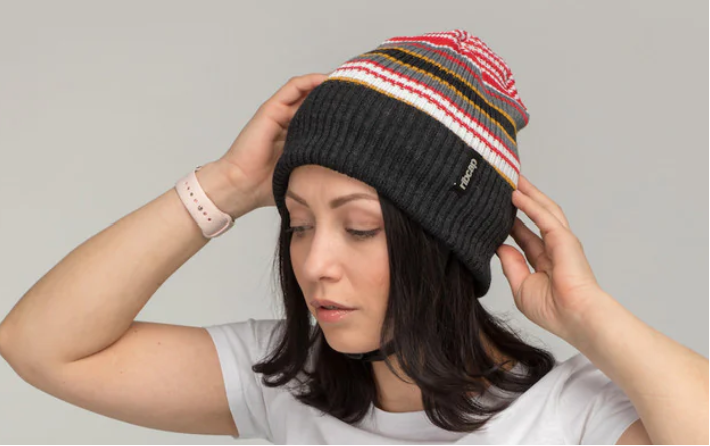 Women wearing a seizure helmet that looks like an ordinary winter hat